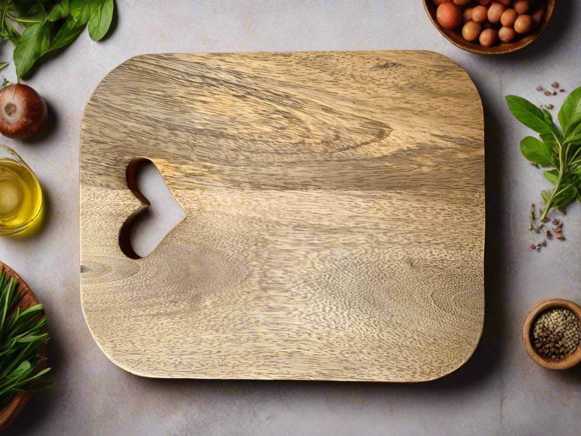 Mango wood chopping boards with cut out hearts. Single board shown.