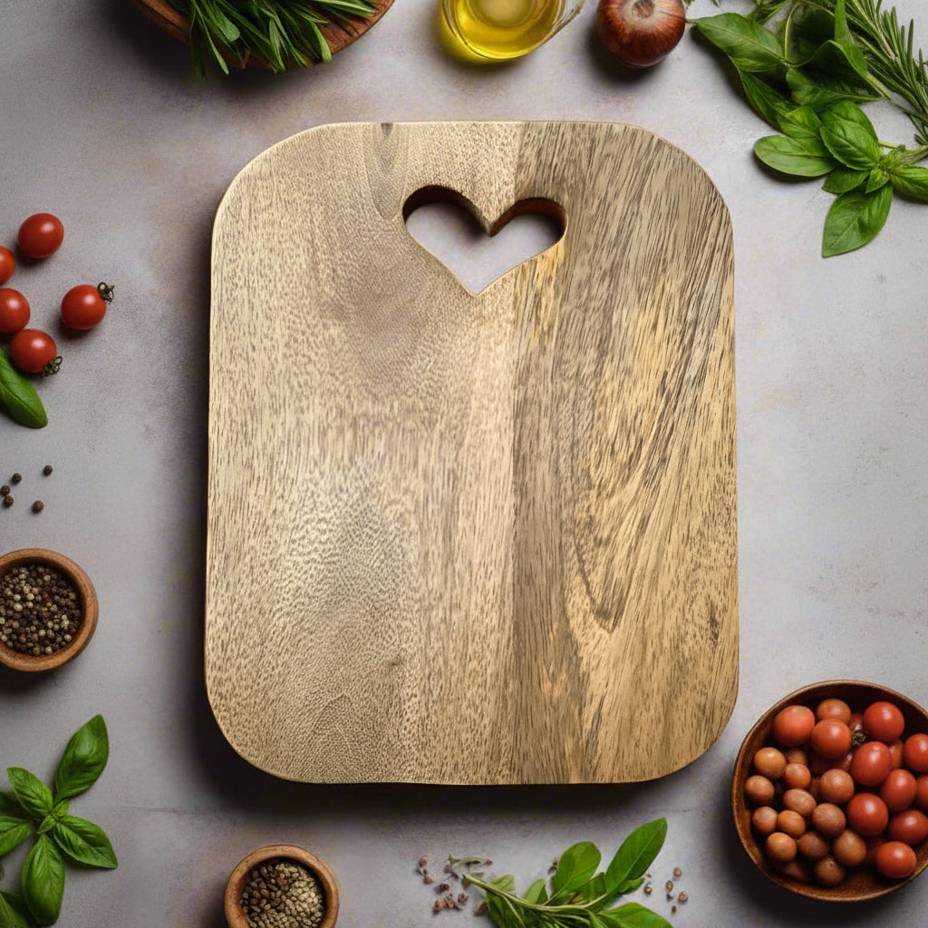 Mango wood chopping boards with cut out hearts. Single board shown.