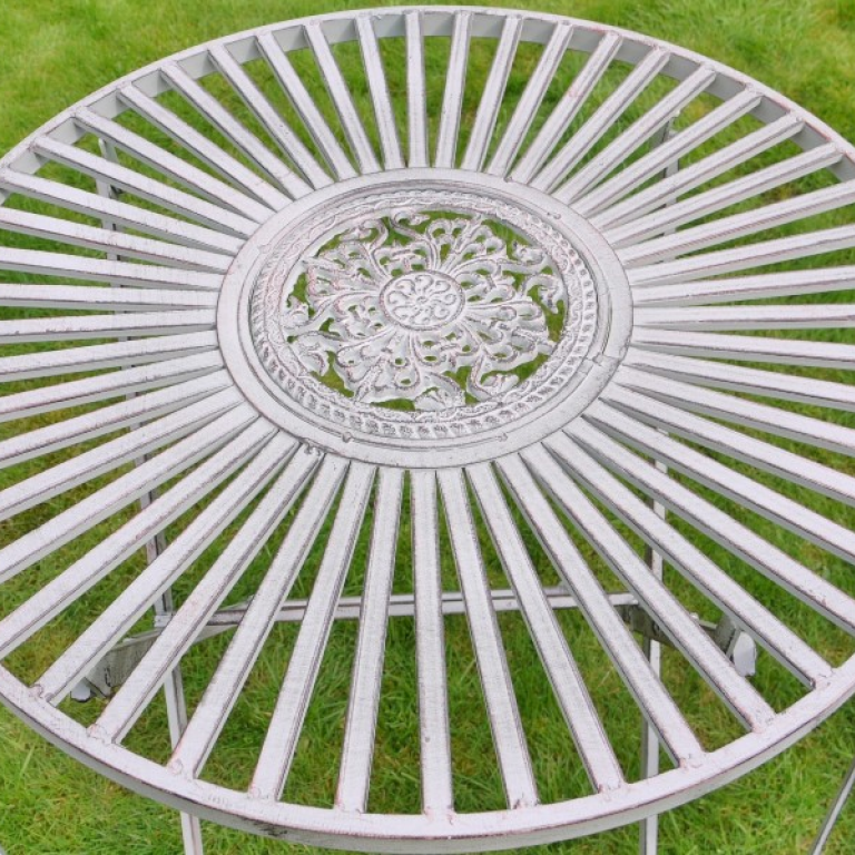 T42 Antique grey bistro set. Close up of table.
