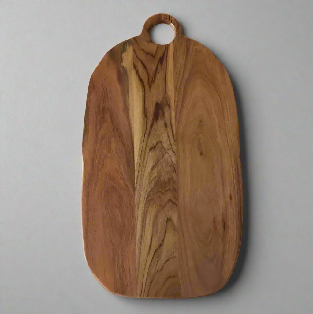 Wooden cutting board with a handle on a white background