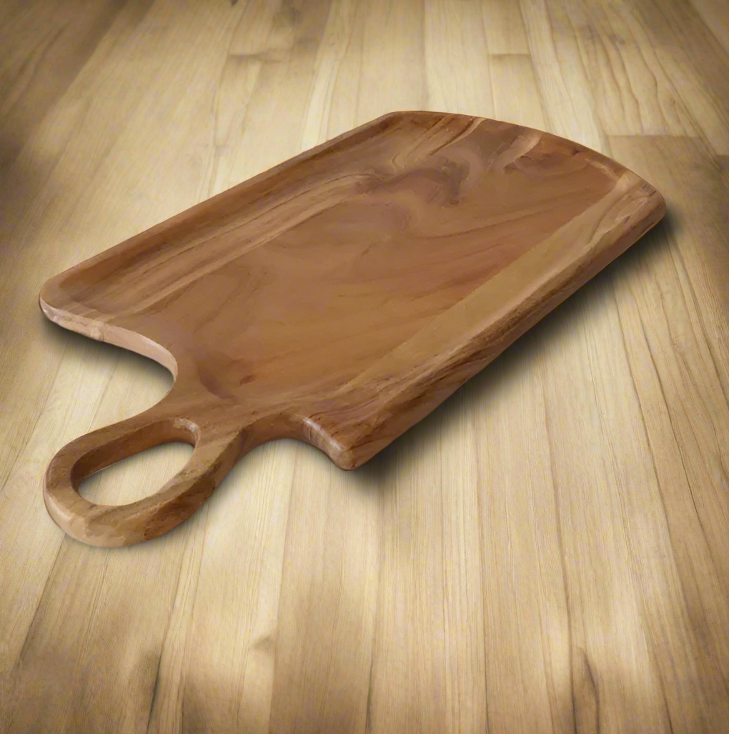Wooden serving board with handle on a light background