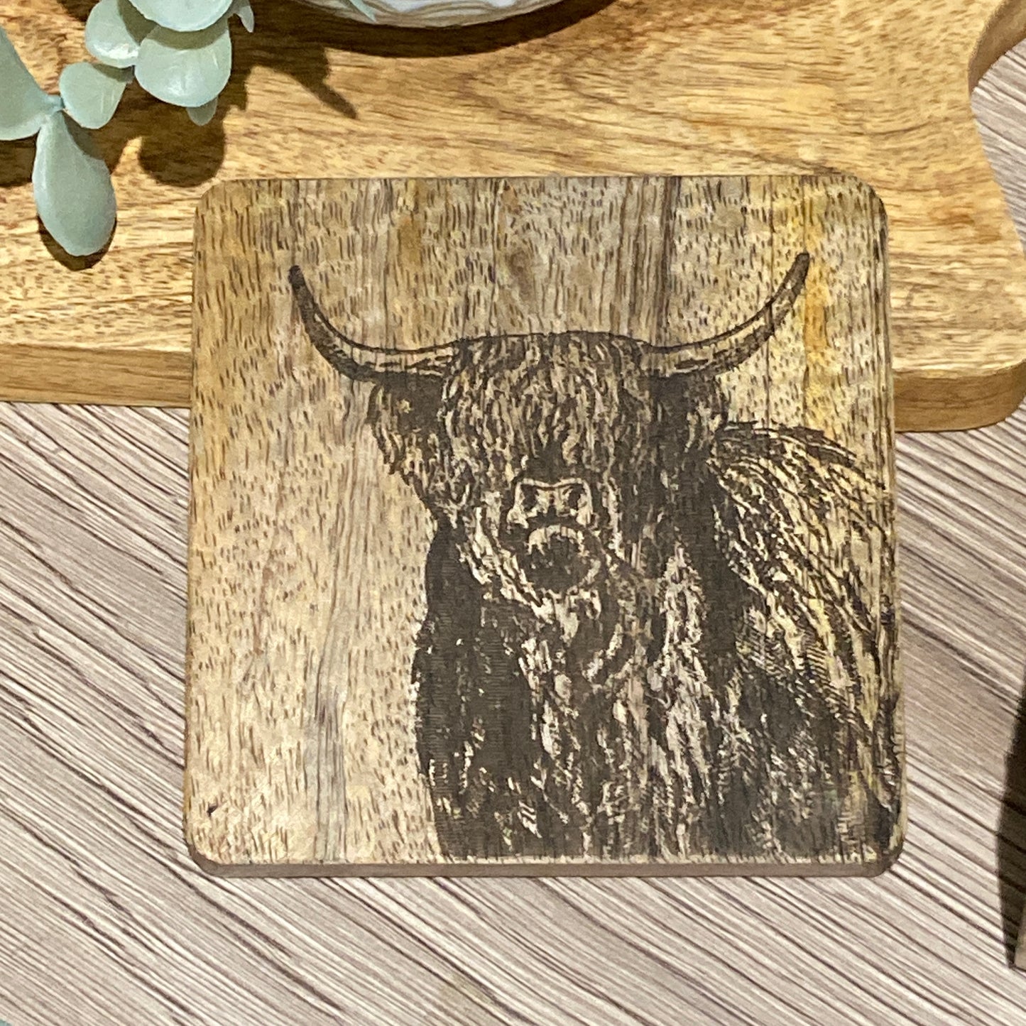 Set of 4 Mango wood square coasters with holder. 10cm square - Etched with Highland cow. Image of one coaster.