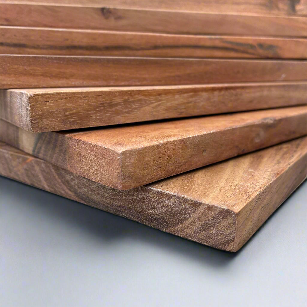 Stack of wooden planks on a light gray surface