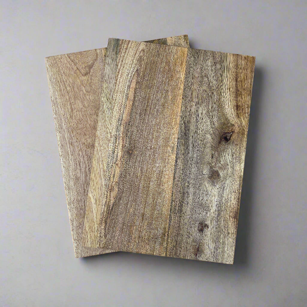 2 pieces of wooden flooring on a grey surface
