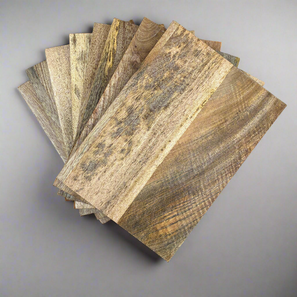 Collection of wooden samples arranged in a circular pattern on a gray background