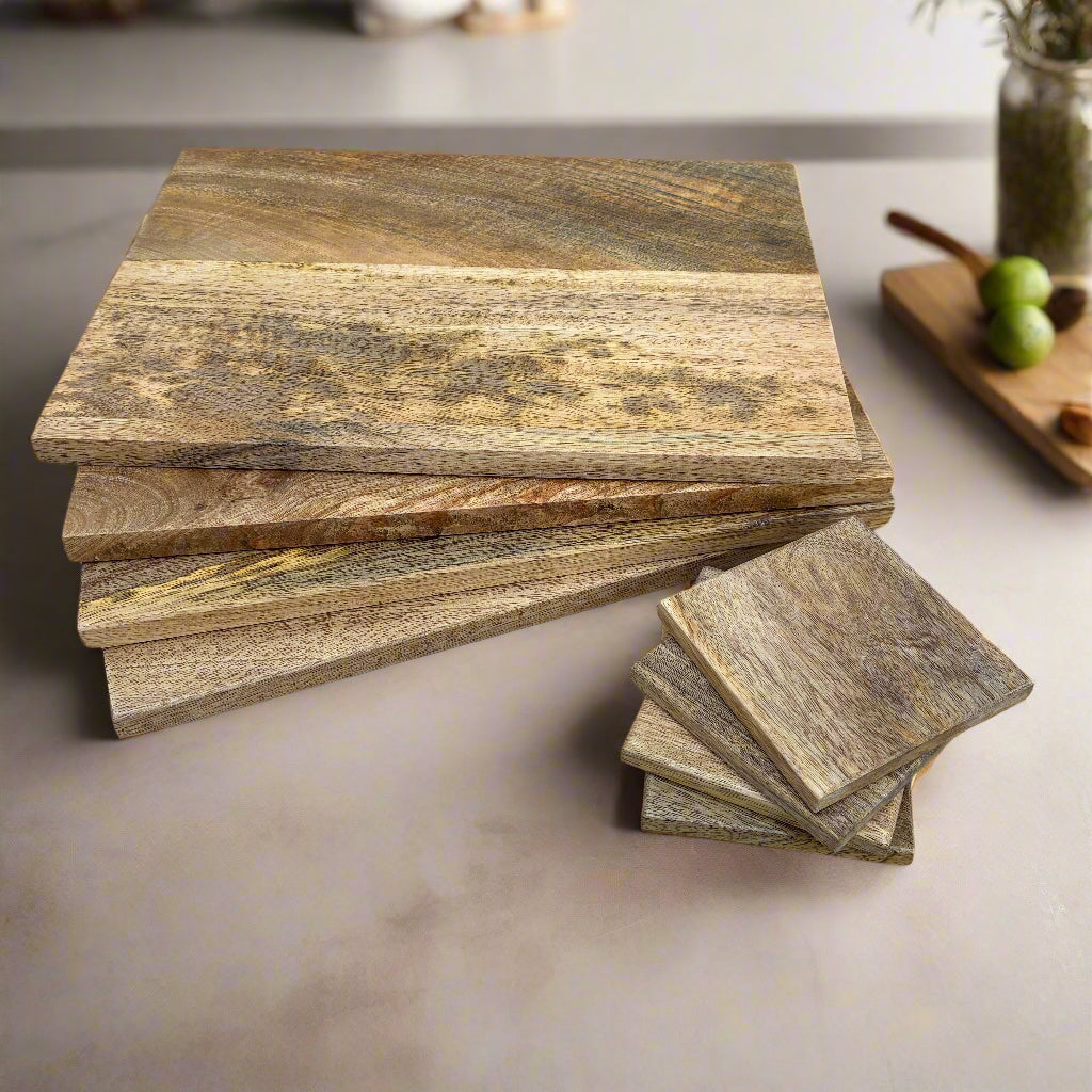 Stack of wooden cutting boards on a kitchen counter
