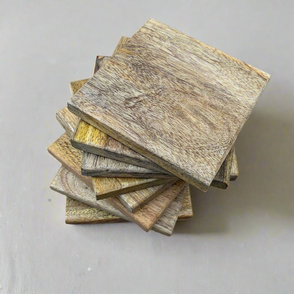 set of 8 mango wood coasters in a stack