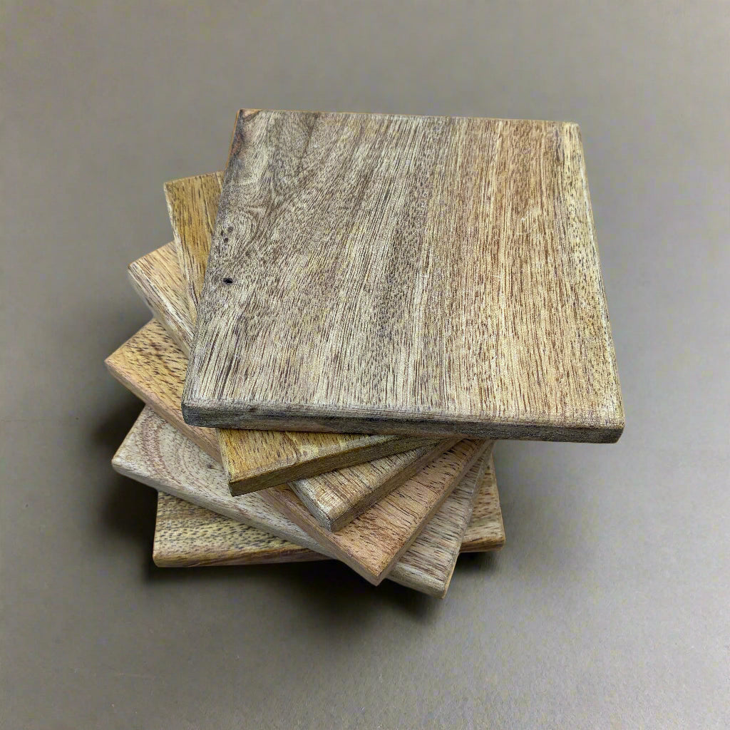 6 mango wood coasters in a stack