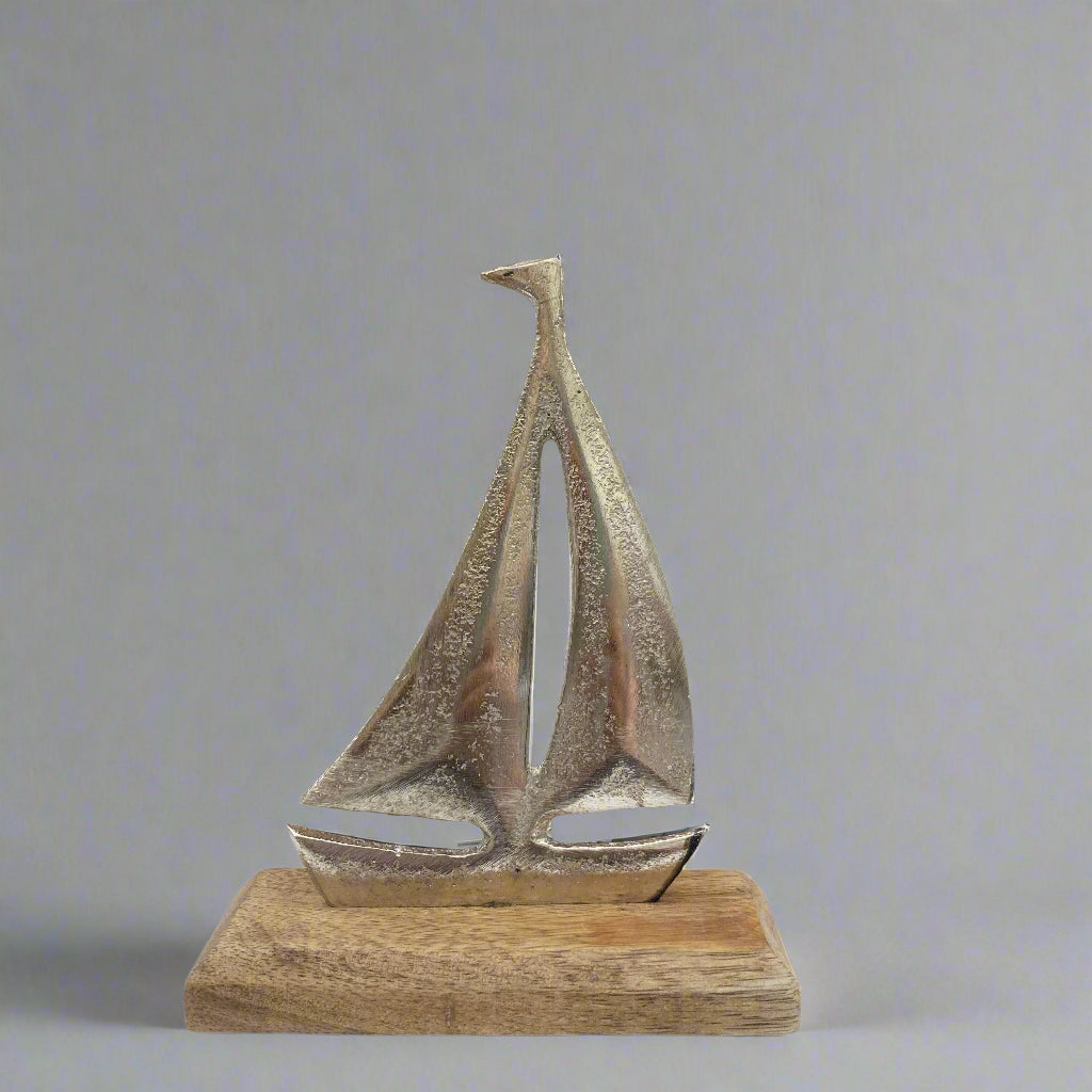 Cast aluminium sailing yachts on Mango wood base. Small boat shown.