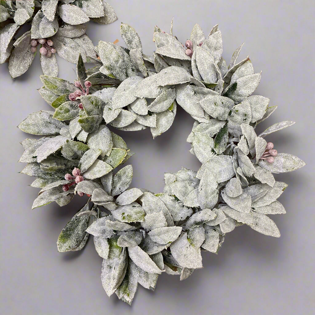 Frosted leaf wreath on a brown background