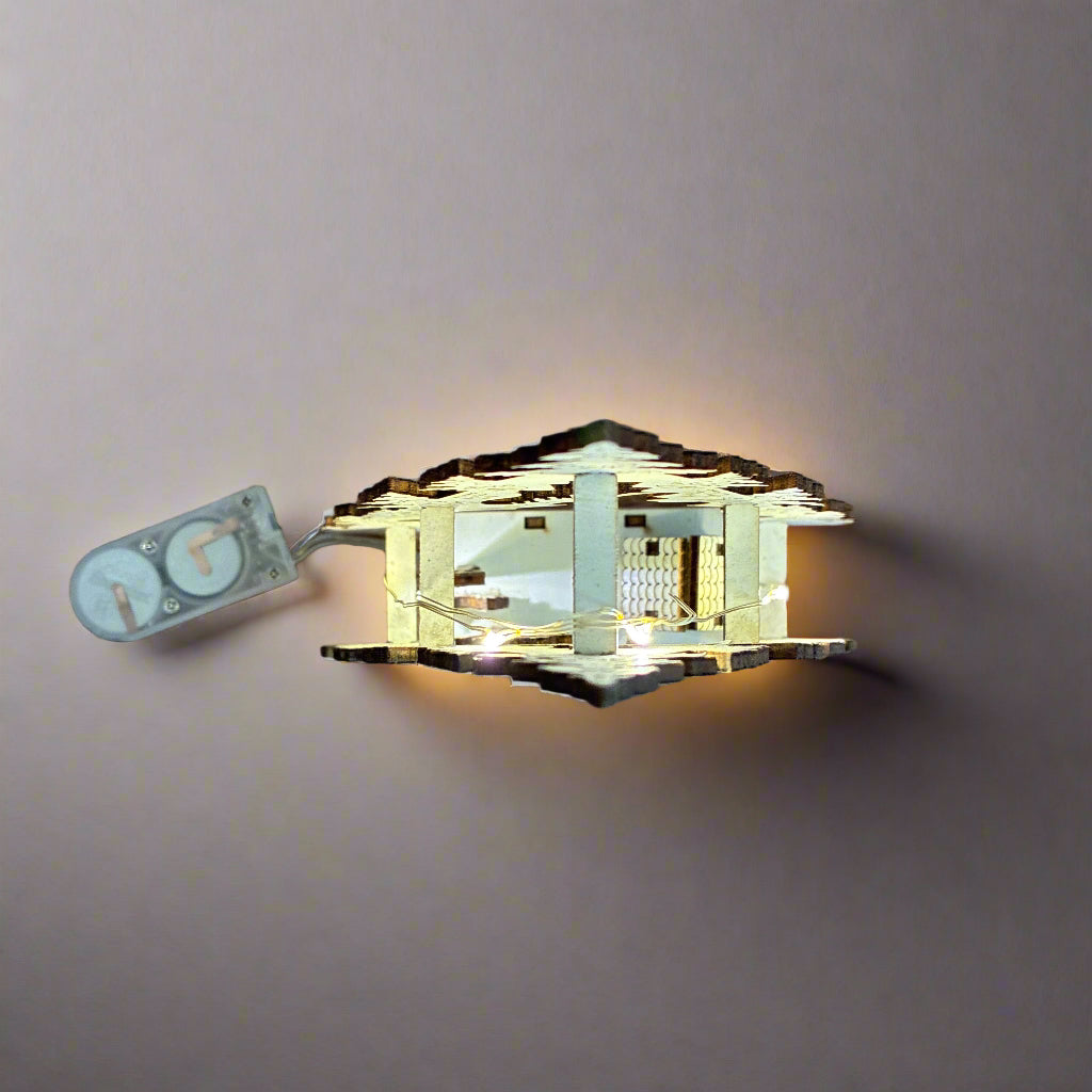 Small model of a building on a wooden surface