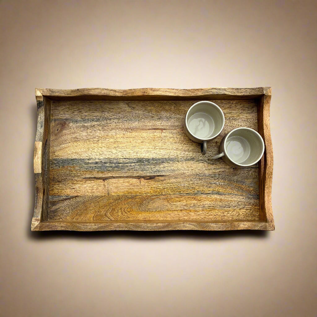 Wooden tray with two mugs on a wooden floor