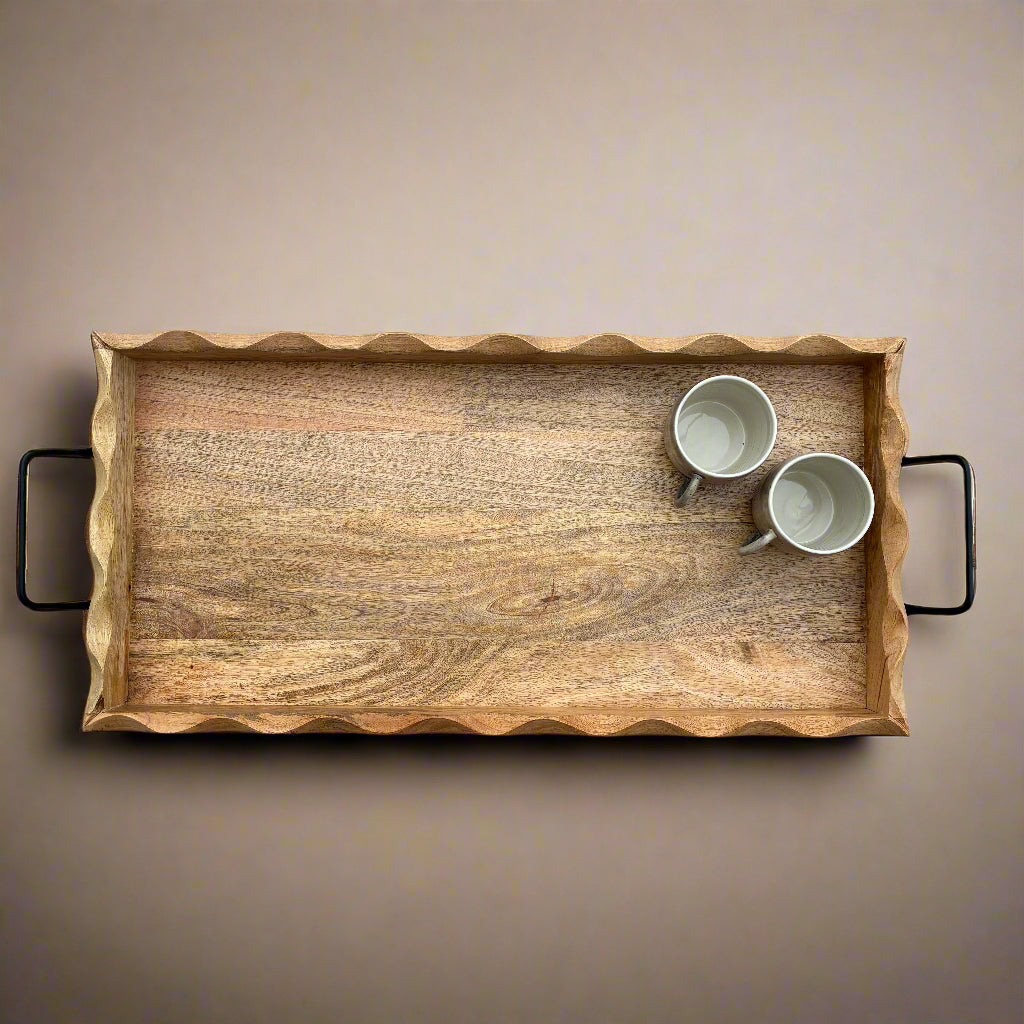 Wooden tray with two white cups on a gray wooden floor
