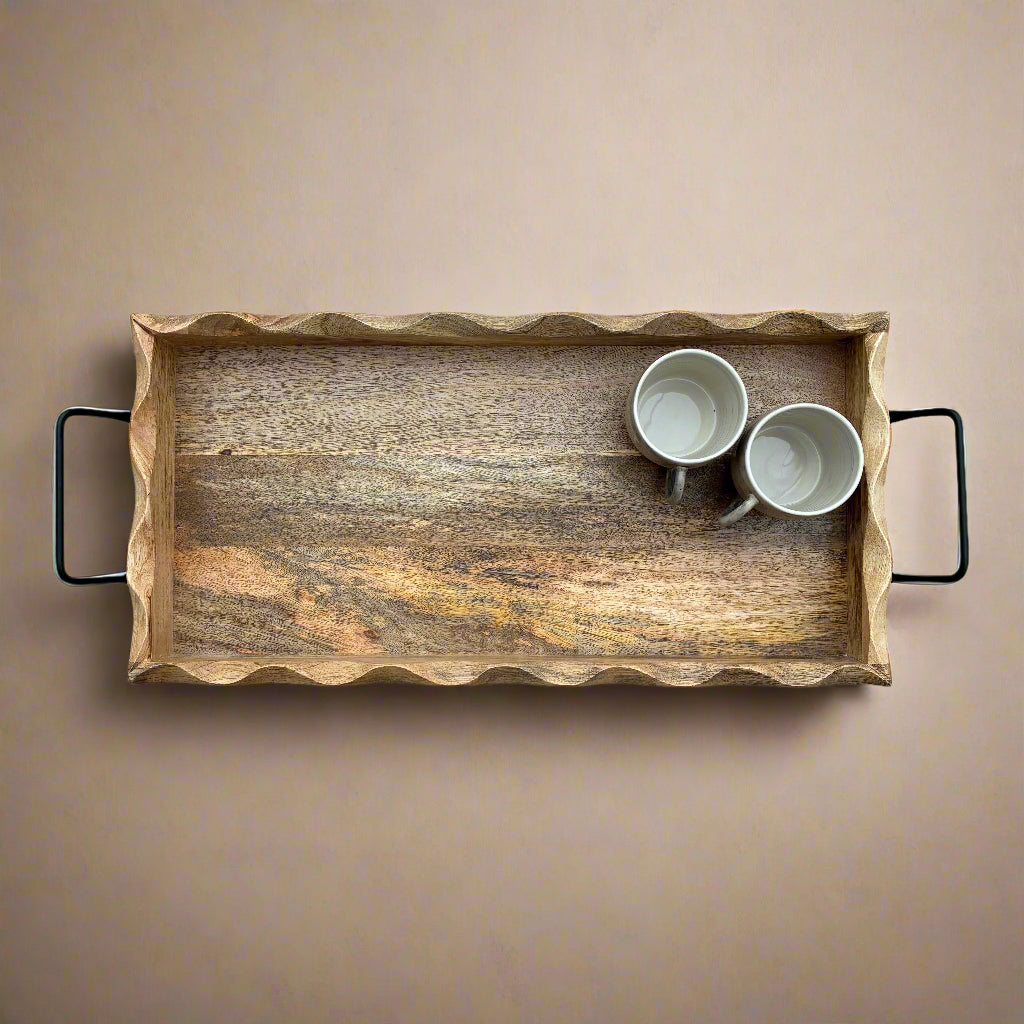 Wooden tray with two white cups on a gray wooden floor