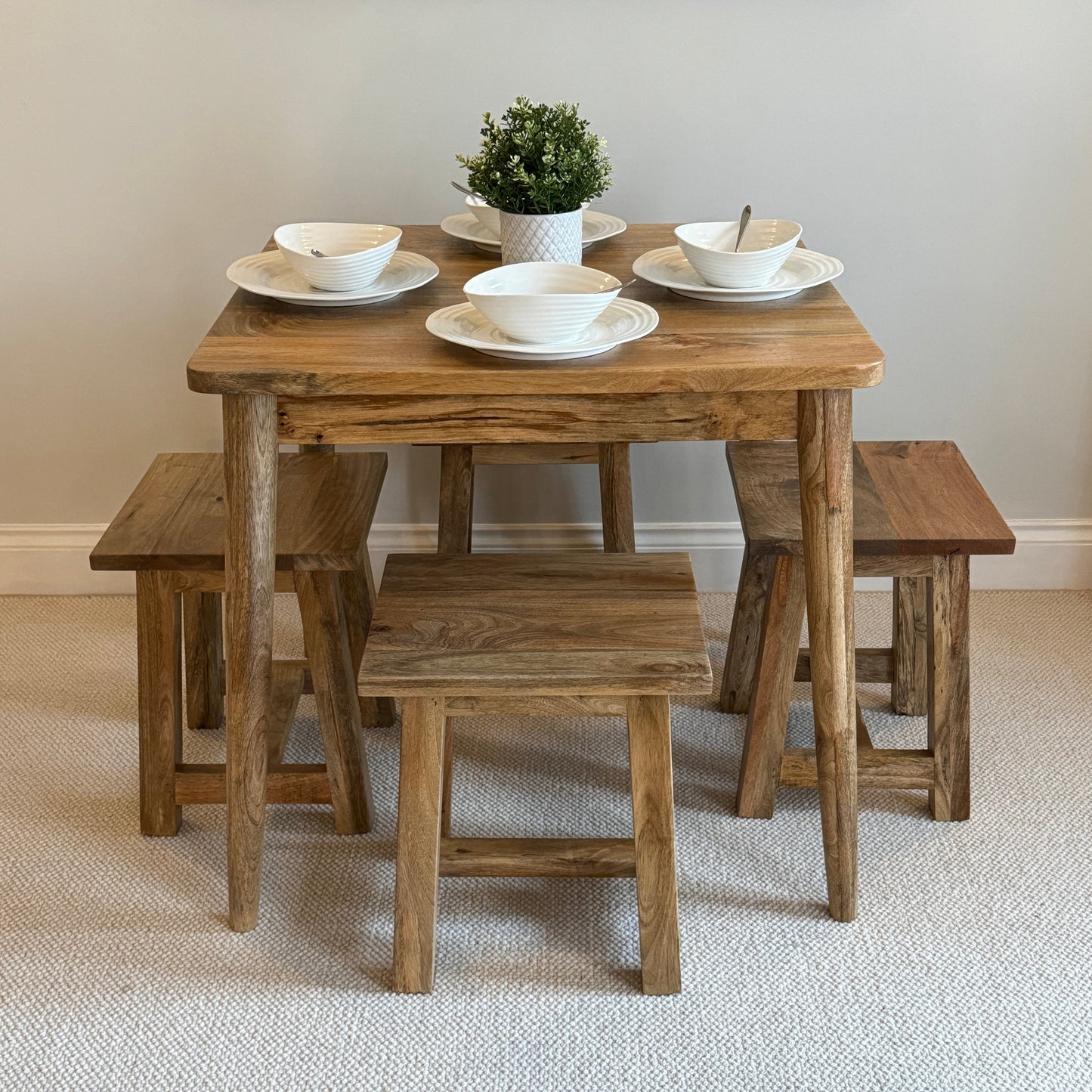 80cm Square Mango dining table with cone shaped legs dressed with 4 settings