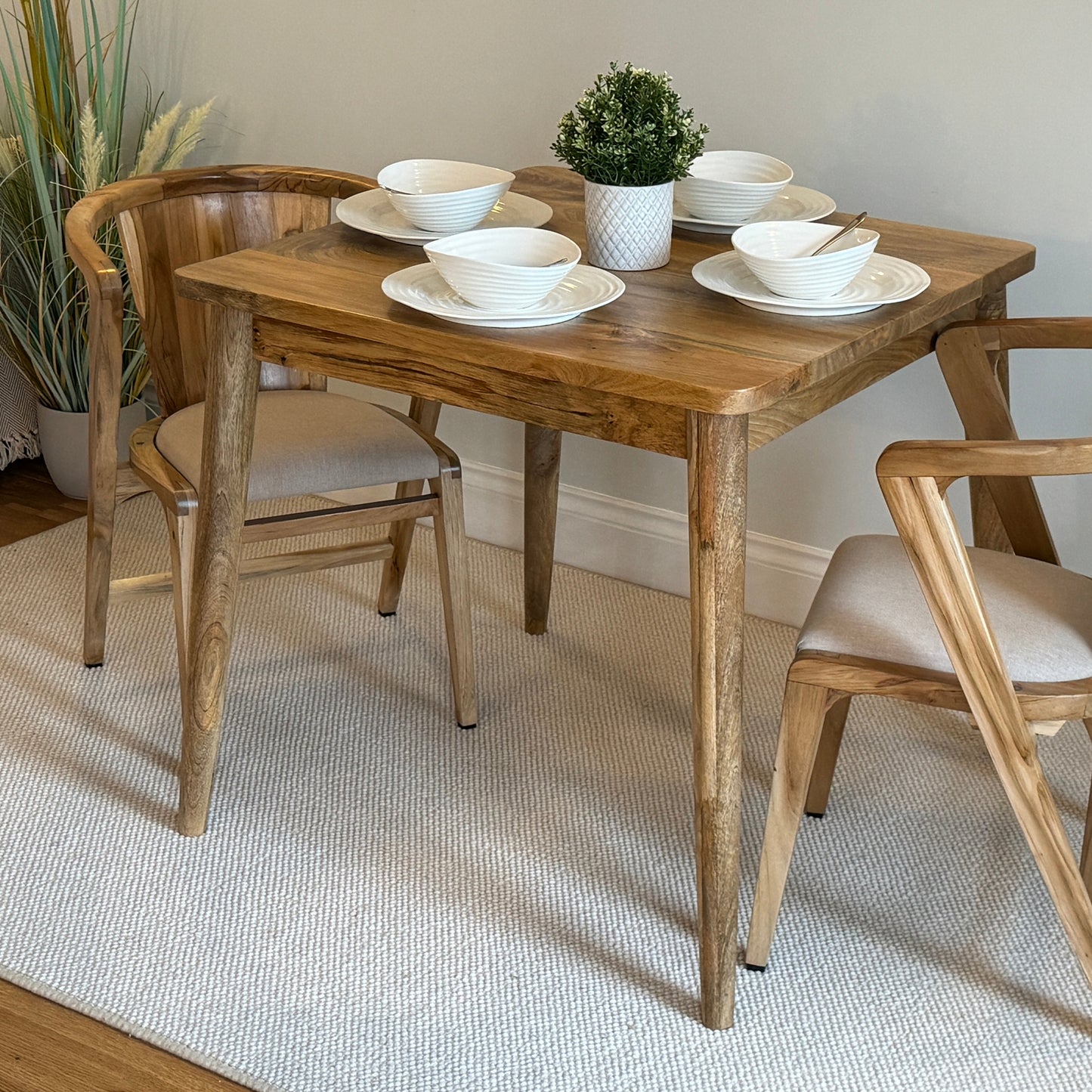 80cm Square Mango dining table with cone shaped legs dressed with 4 settings