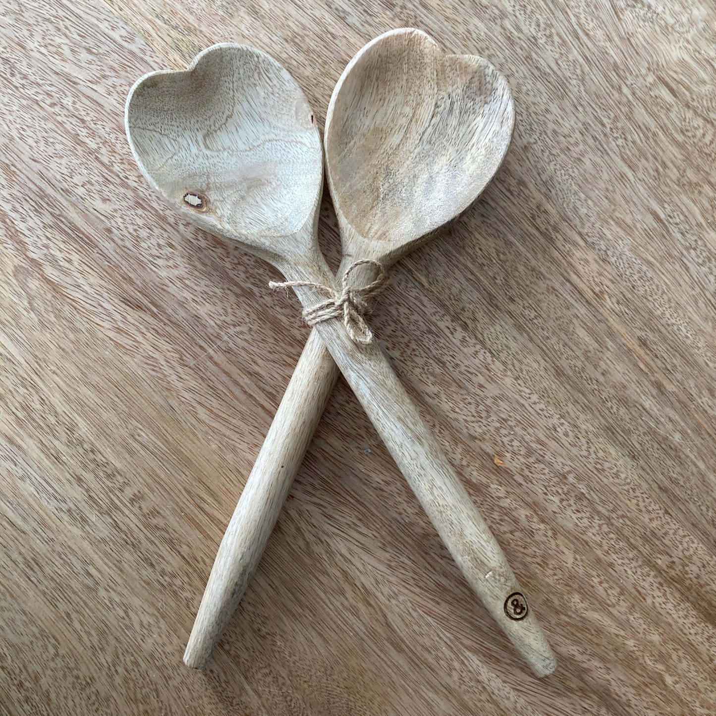 pair of wood heart shaped spoons for serving salad