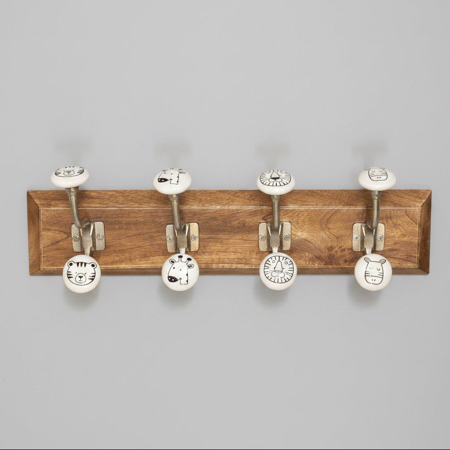 Wooden wall hook with six metal hooks on a gray background