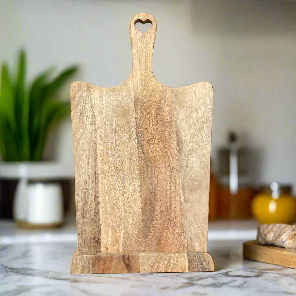 Tall Mango wood recipe stand with cut out heart handle. Straight on.