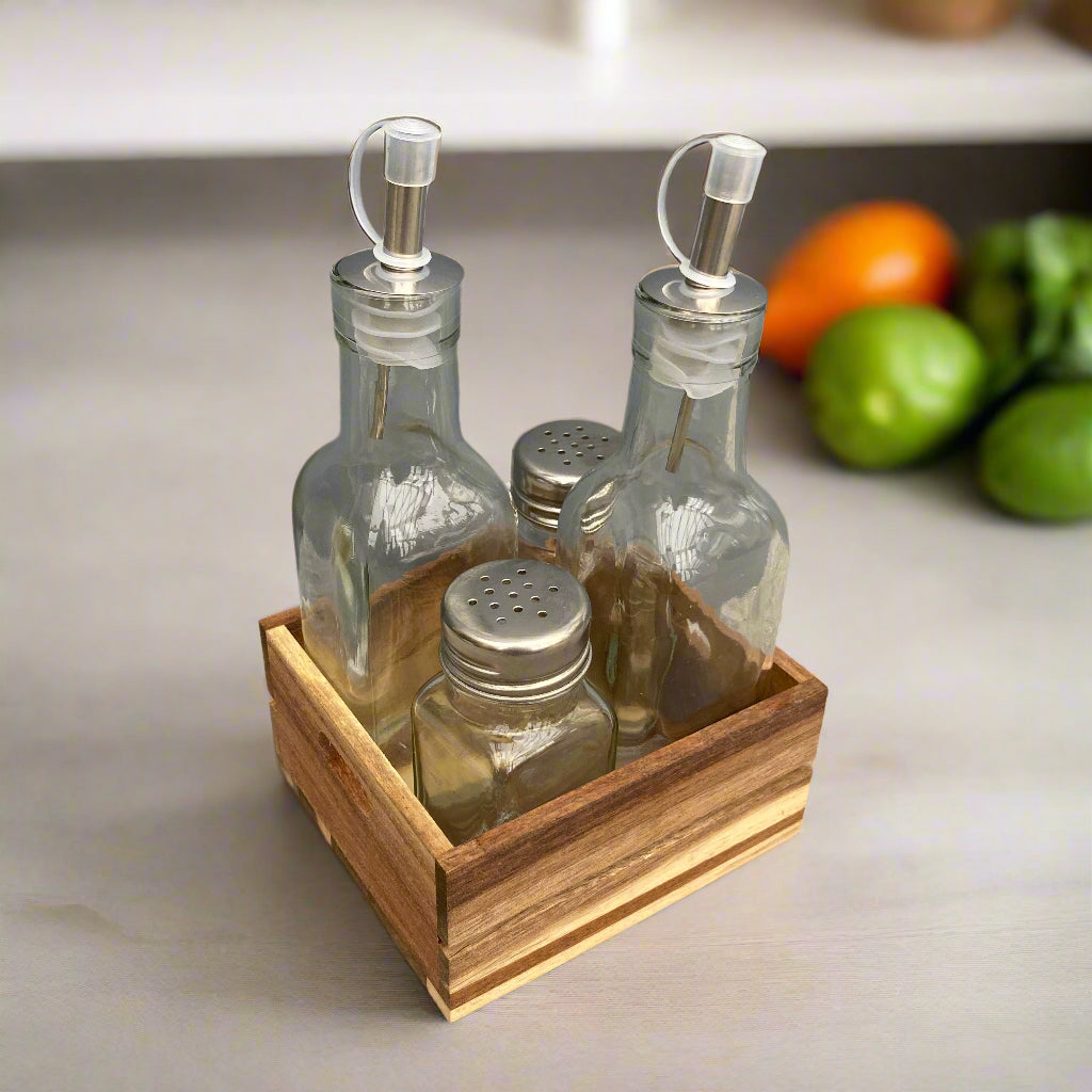 Acacia wood condiment tray. Salt & pepper shakers, oil & vinegar bottles included. Shot from an angle.