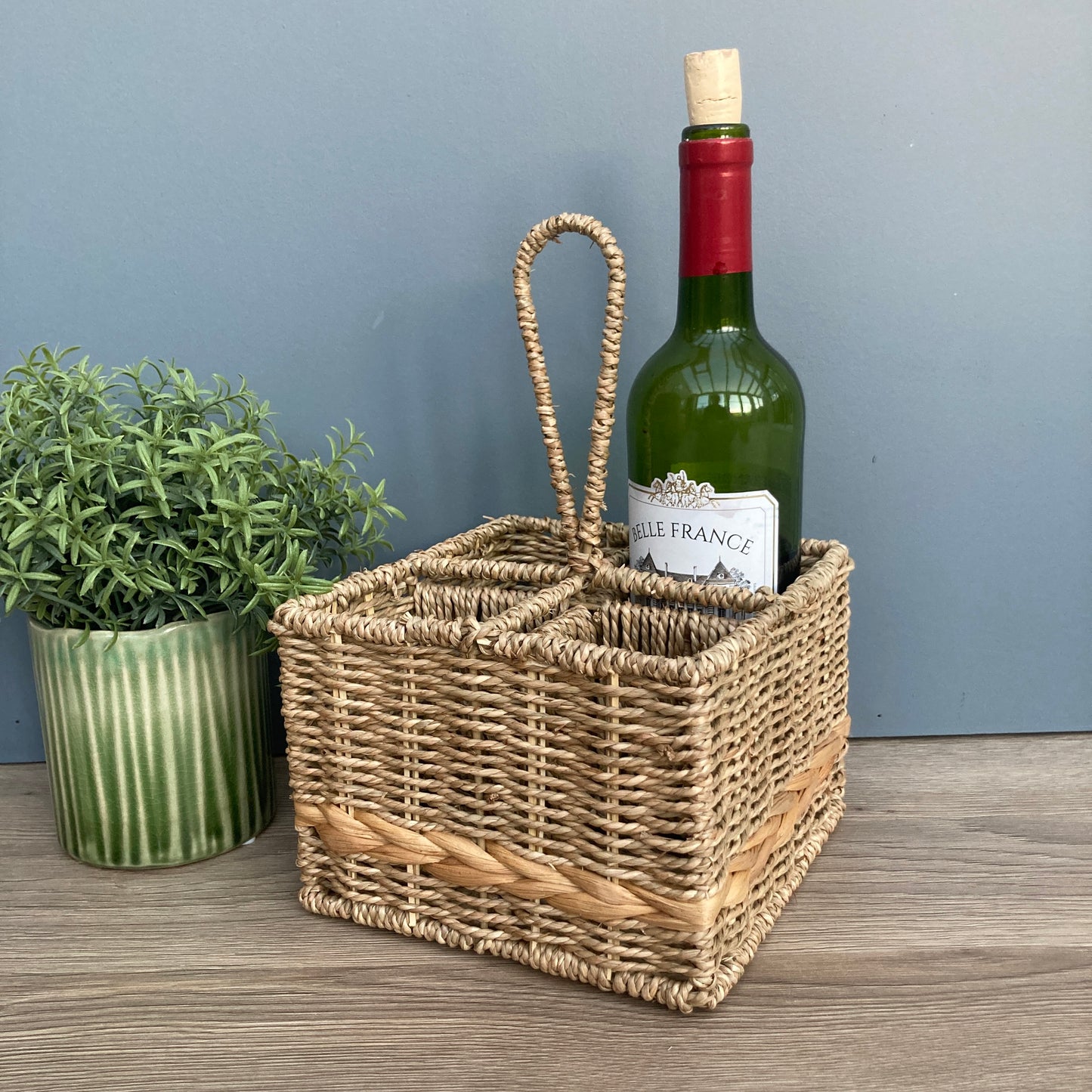Woven seagrass and water hyacinth condiment caddy with wine bottle