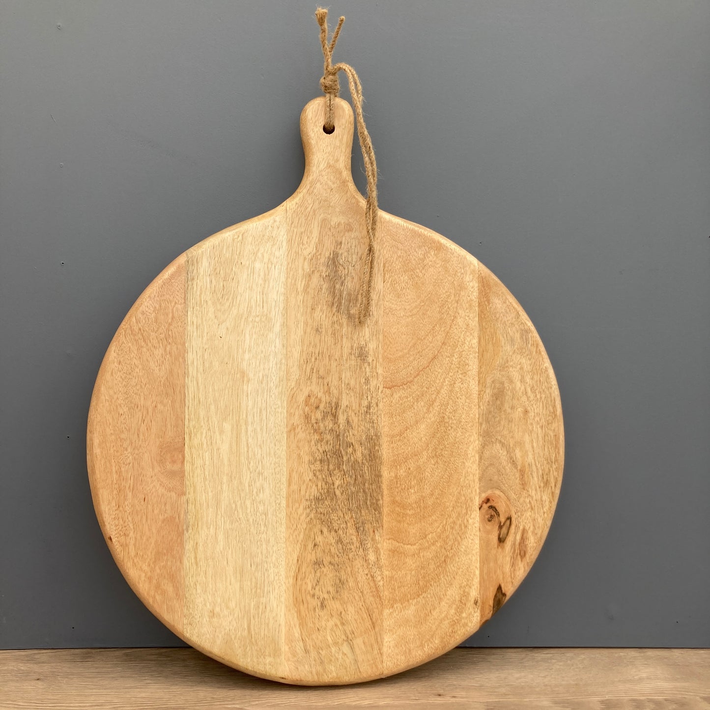 Large Mango wood chopping board on a grey background