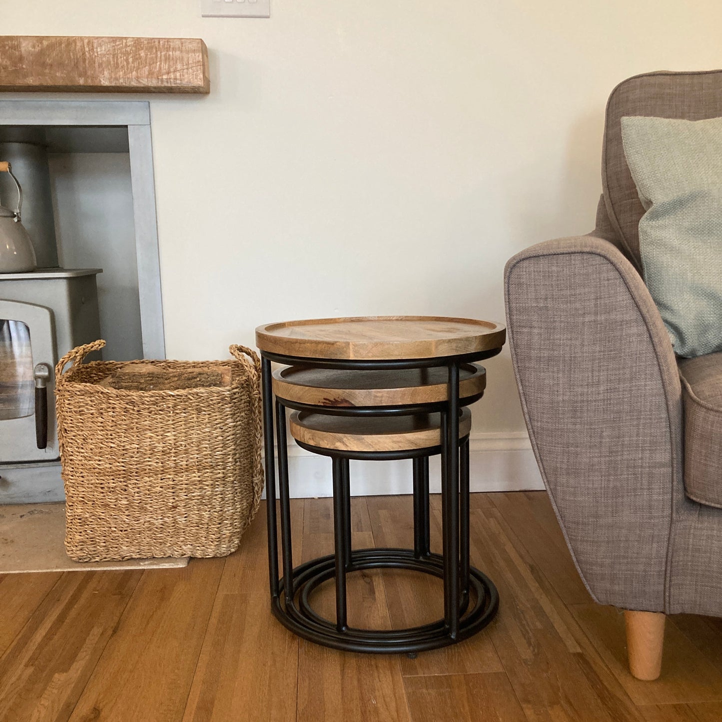 Industrial nest of 3 tables by a wood burner