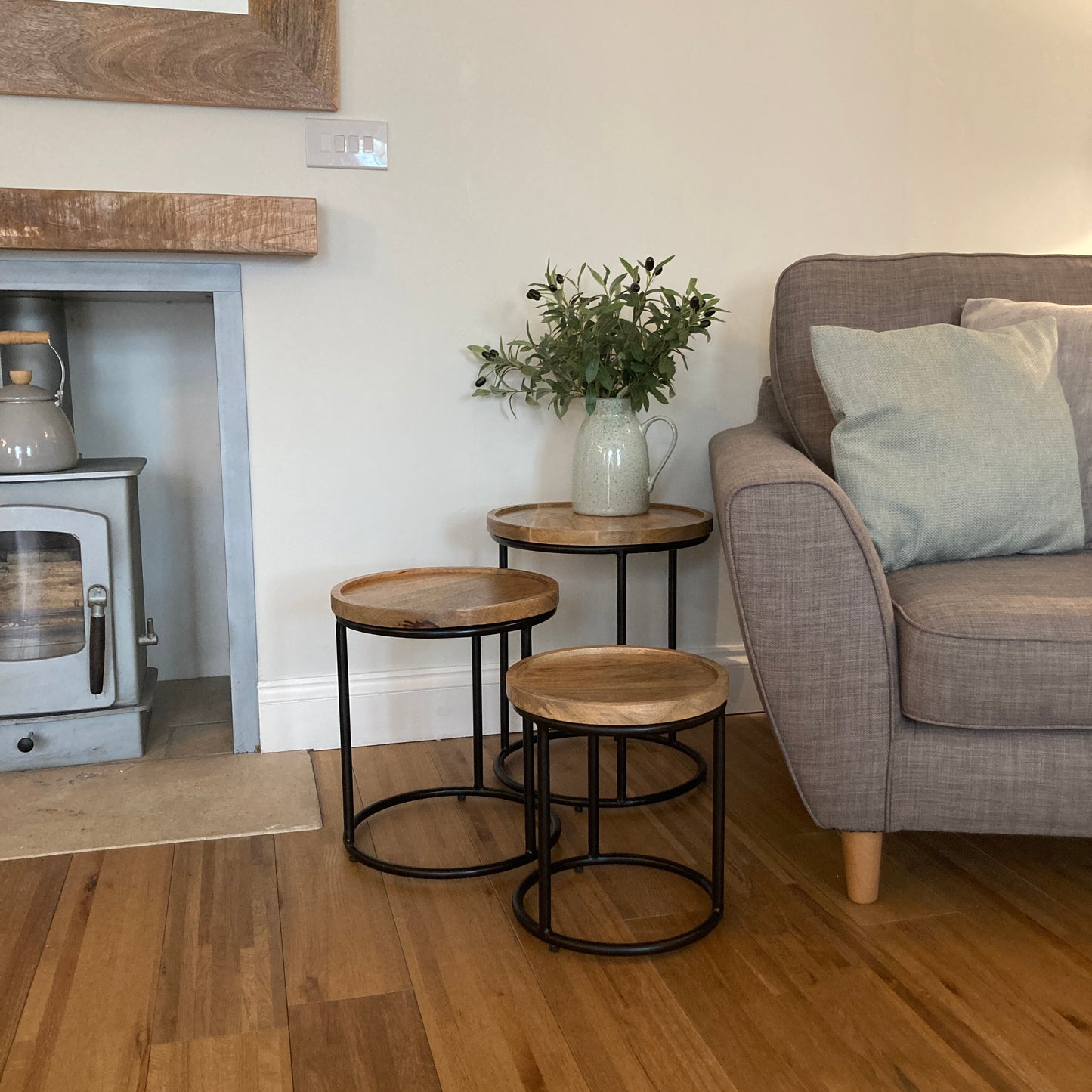 Industrial nest of 3 tables next to a side chair