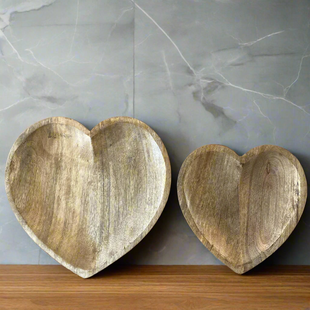 Hand carved solid Mango wood wooden heart dish / bowl in two sizes with marble back drop.