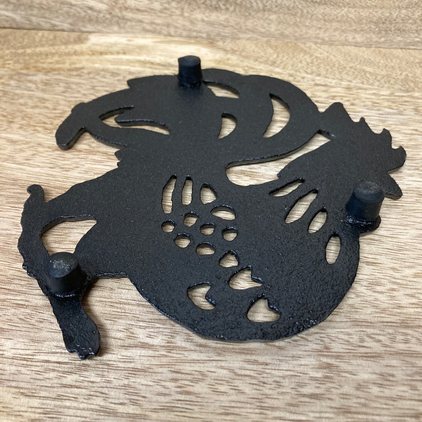Black painted cast iron ROOSTER design trivet / hotplate - underneath