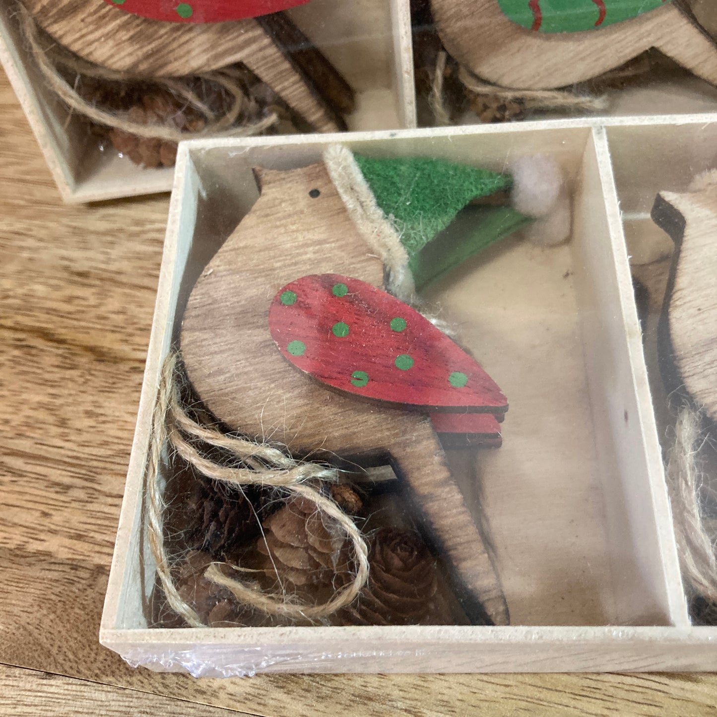 Close up of wooden robin in box