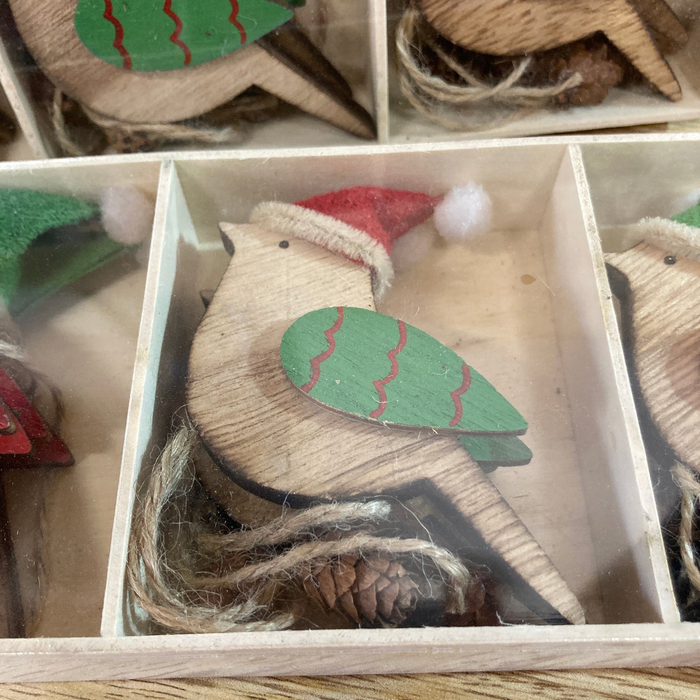 Close up of wooden robin in box - green wing