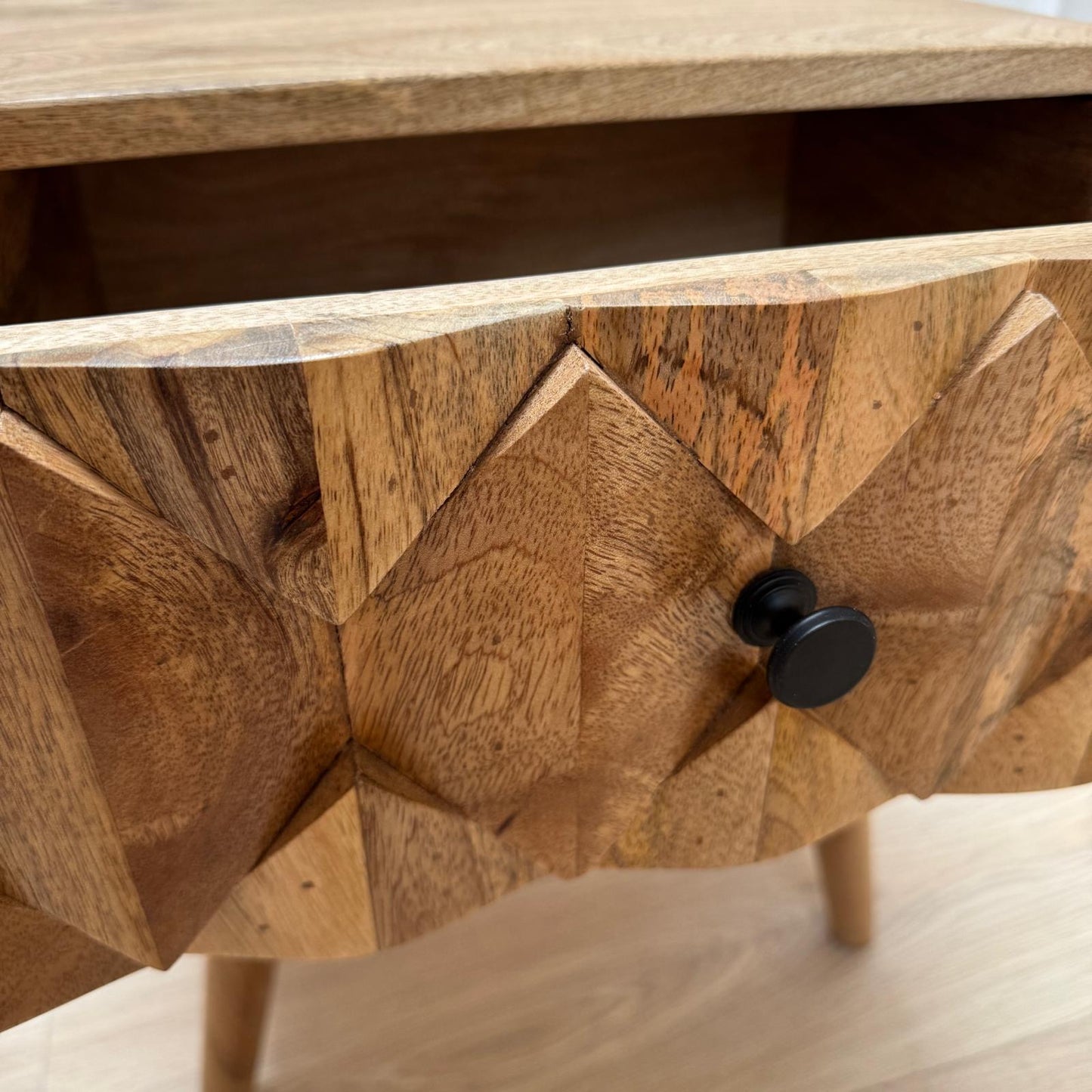 Wooden drawer with geometric pattern and black handle
