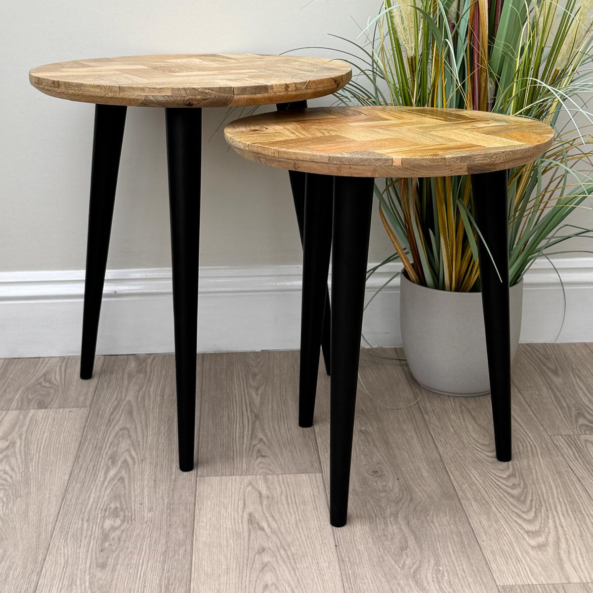 IMANT-002 Nest of 2 round Mango Parquet side tables rom the side