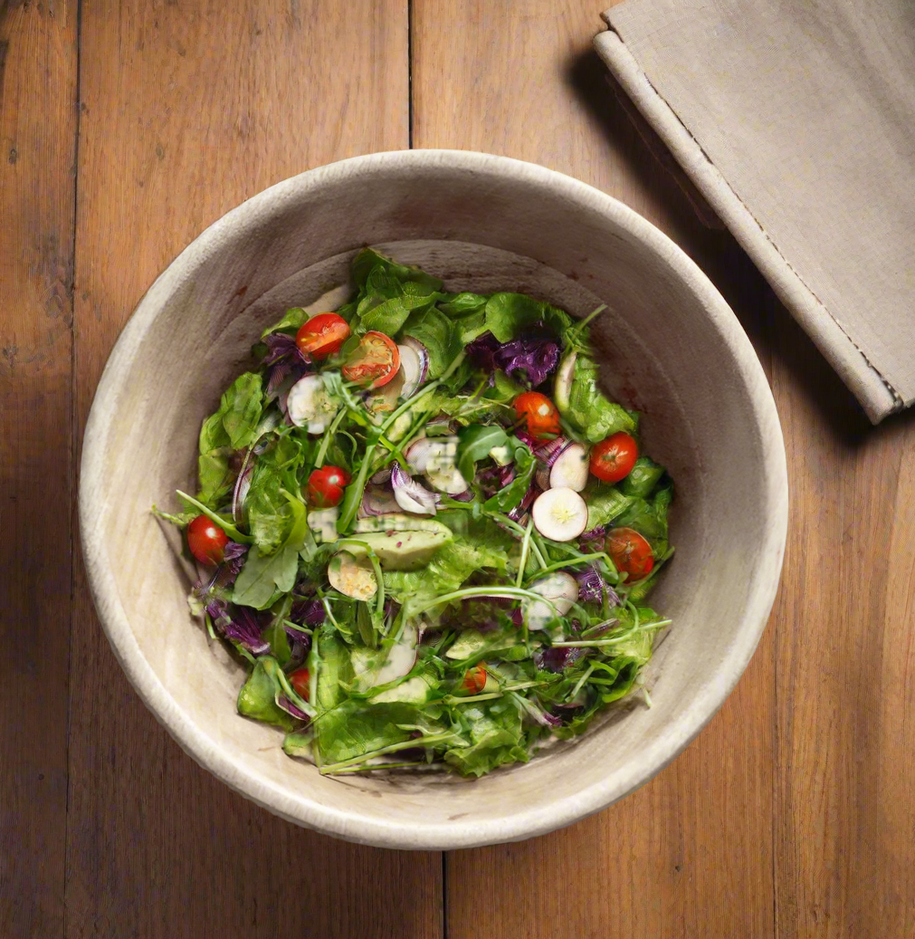 Beautiful Mango wood bowl in a kitchen setting with salad