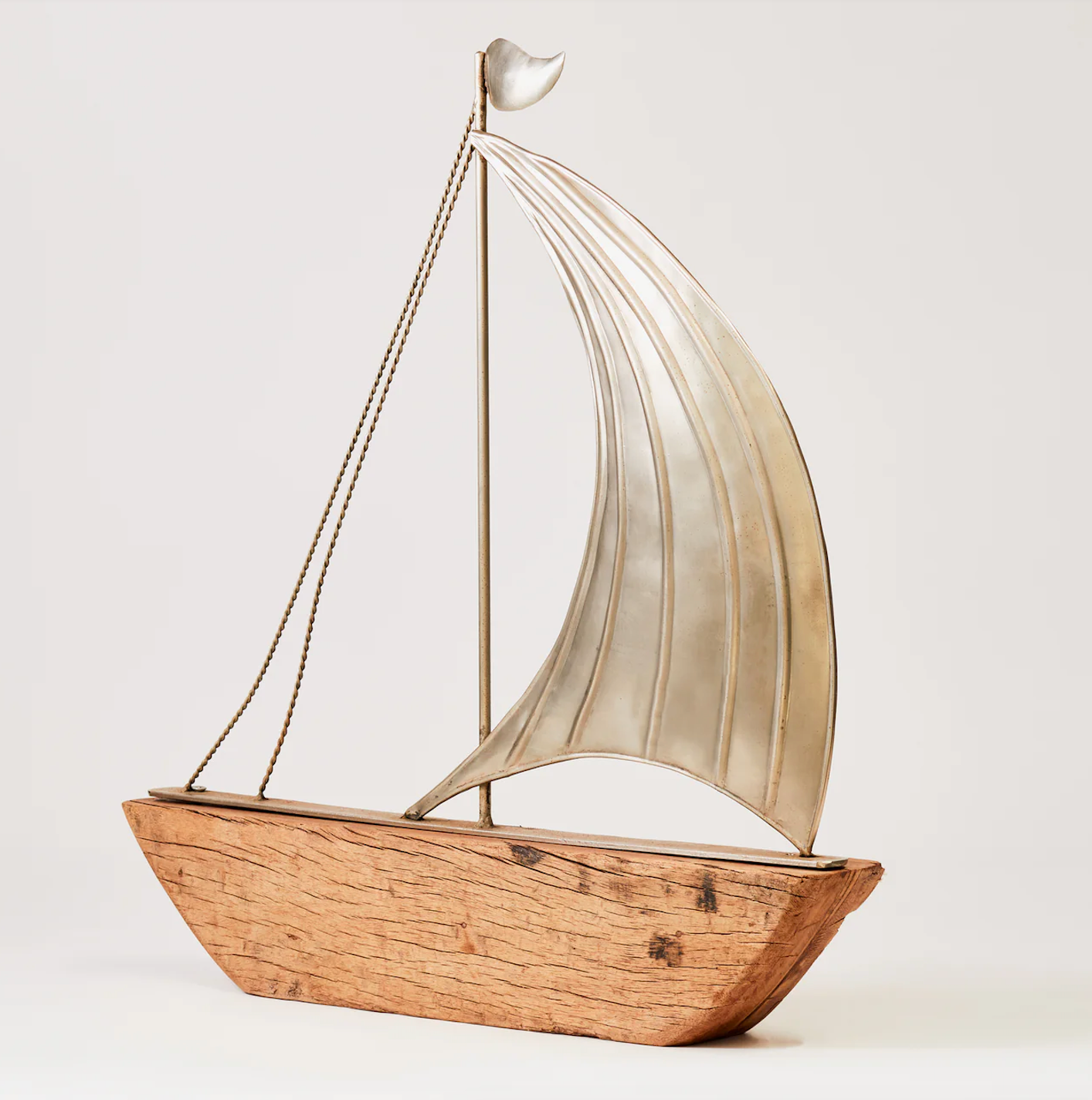 Large reclaimed rustic wood yachts with metal sail - single sail design side on