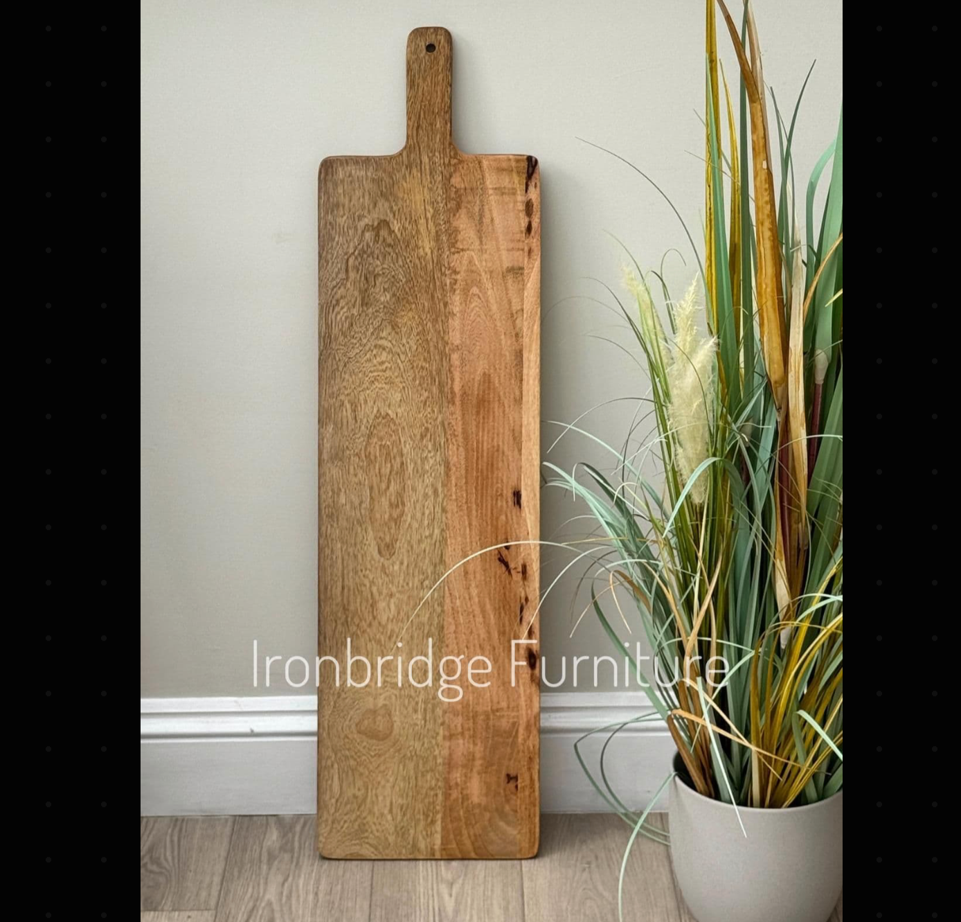 Extra long Mezzo Charcuterie board standing up to show how long it is