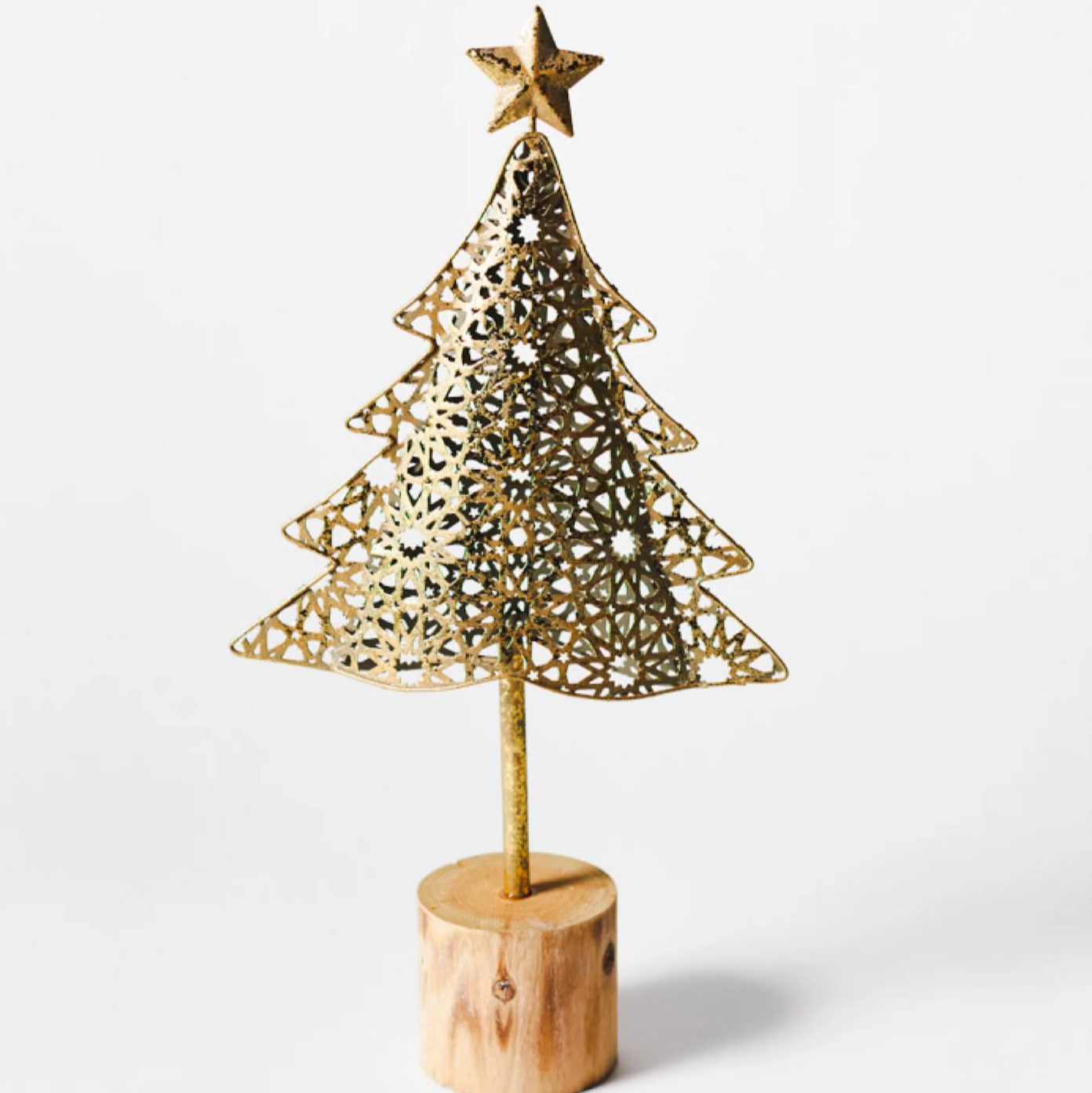 Gold metal Christmas tree on wood log base - one size shown