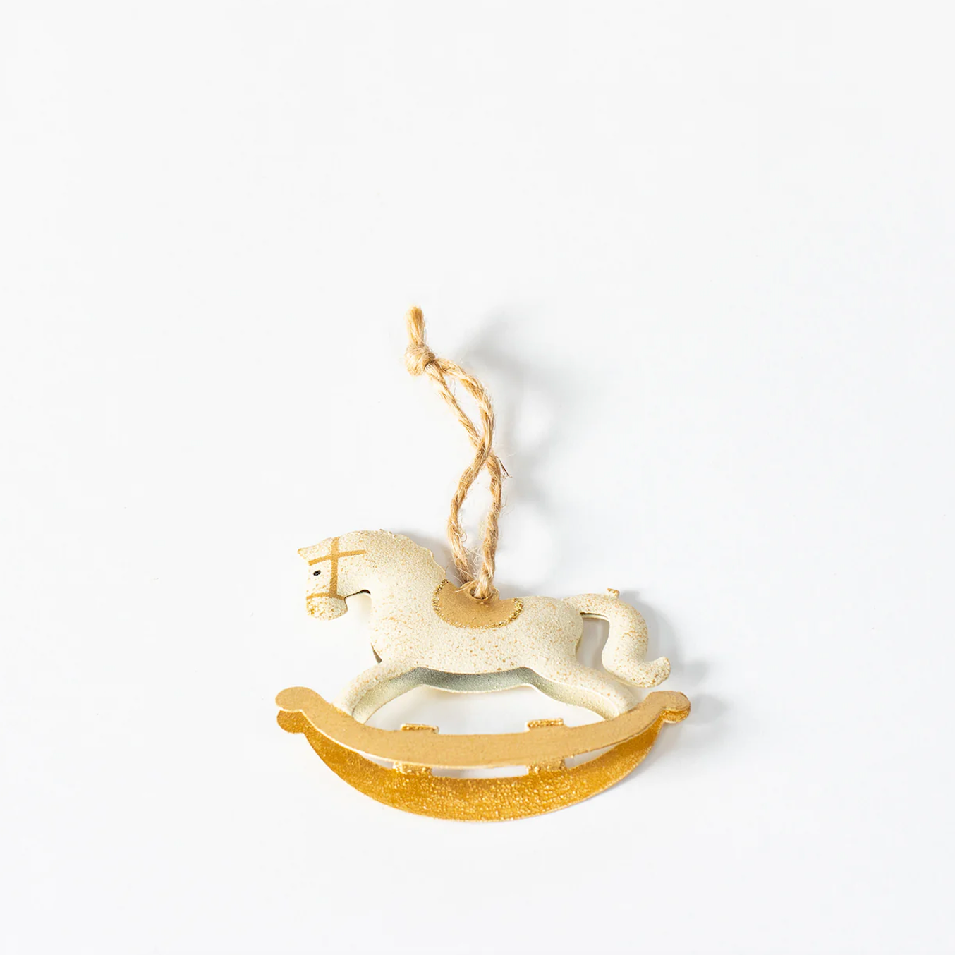Single rocking horse decoration with wooden base - laying down.