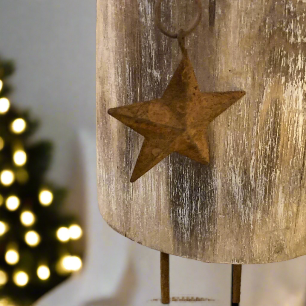 Floor standing reindeer decoration - wood with metal detail - close up of star.
