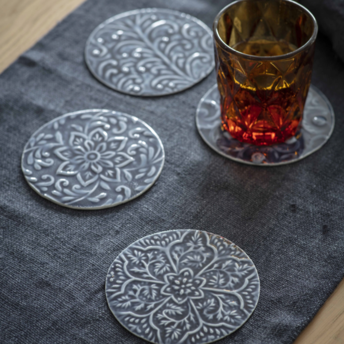 Set of 4 metal coasters - with drink.