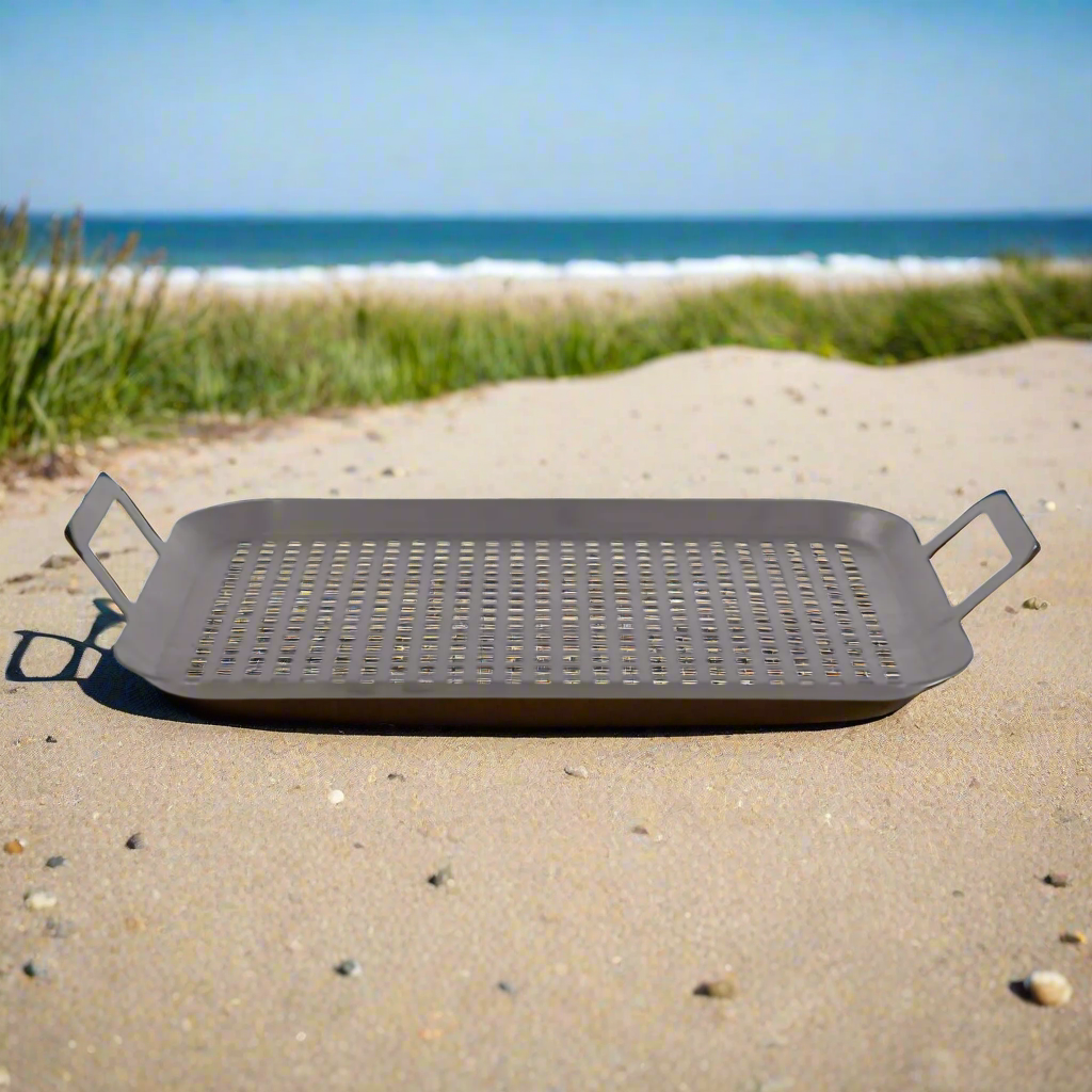 Set of 2 Stainless steel BBQ trays at the beach.