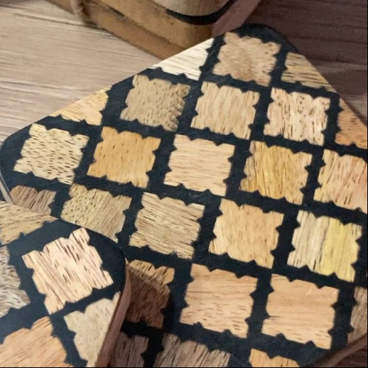 Set of 4 resin coasters with Mango wood inlay and base. Close up.