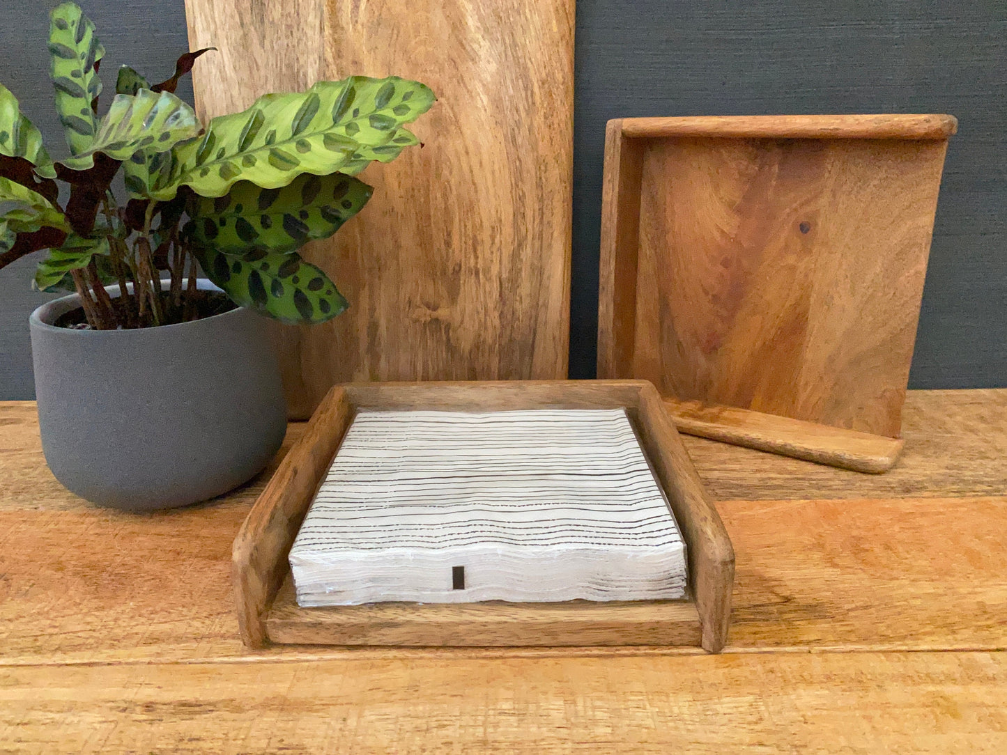 Mango wood napkin holder - standard size - shown with napkins.