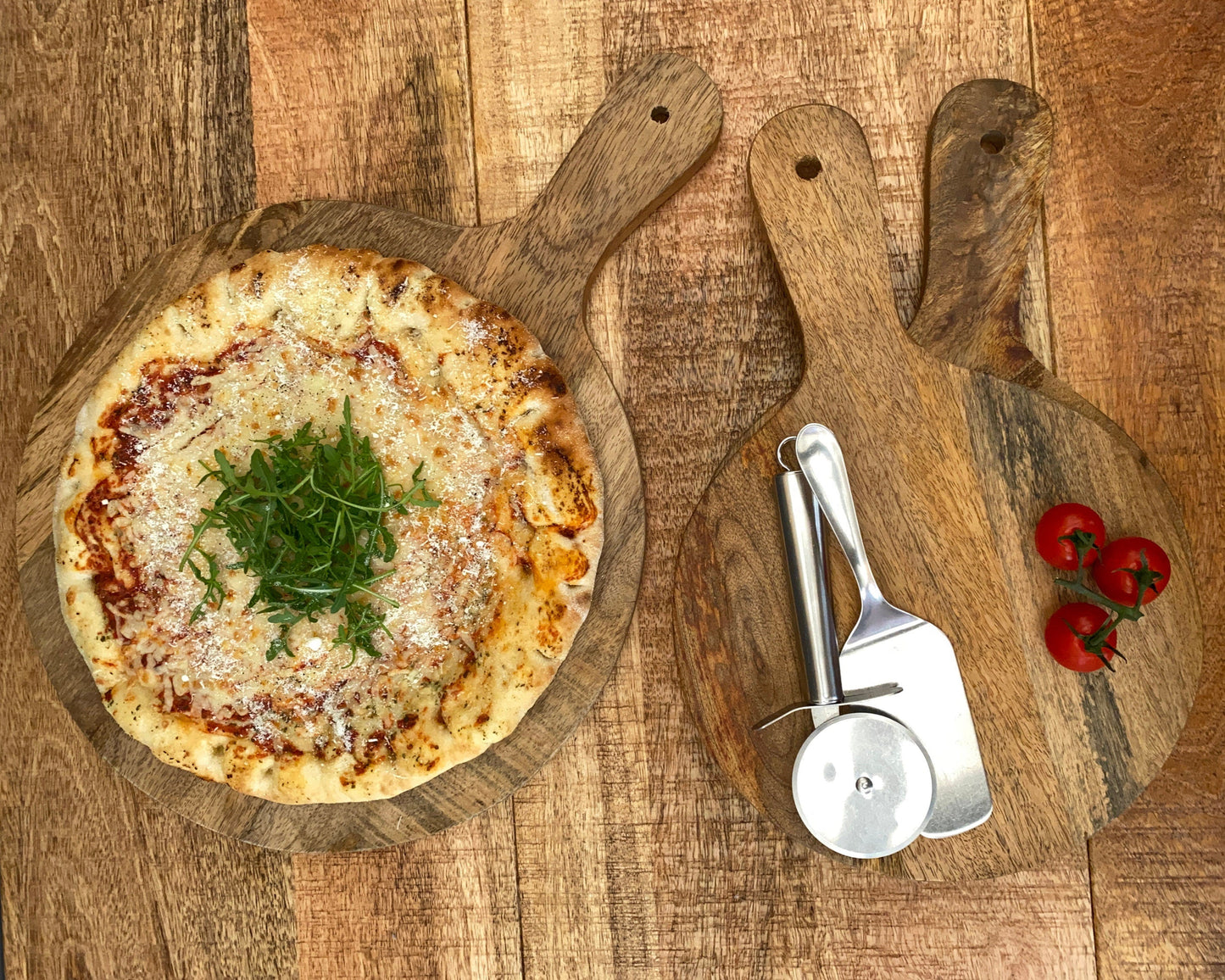 Mango wood pizza paddle board 14, 11 or 10 inch wide, display with pizza