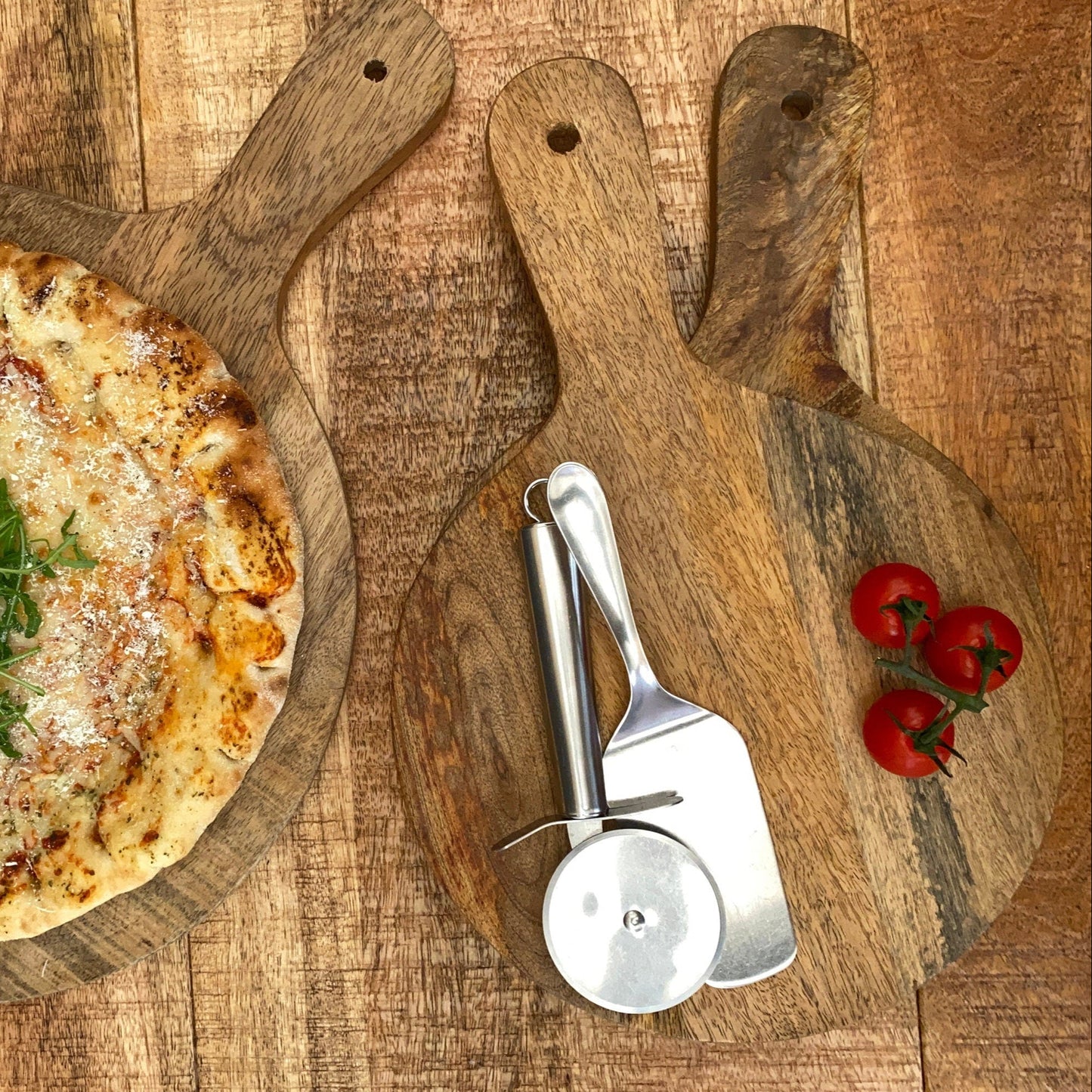 Mango wood pizza paddle board 14, 11 or 10 inch wide, display with pizza