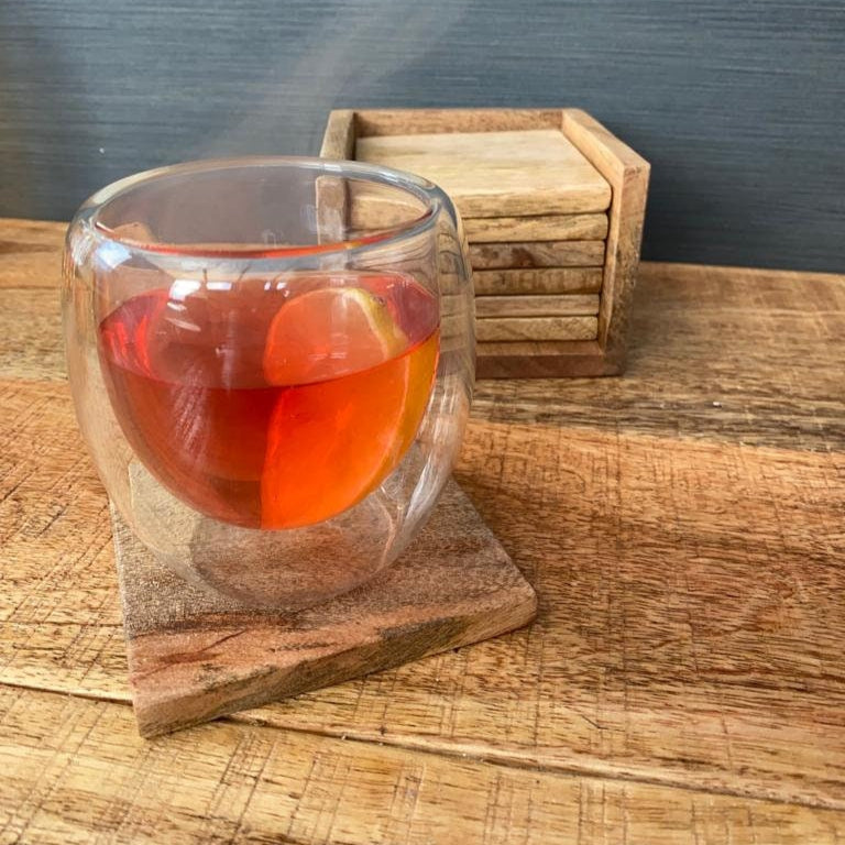 Set of 6 solid Mango wood square coasters with holder. Coaster with full glass.