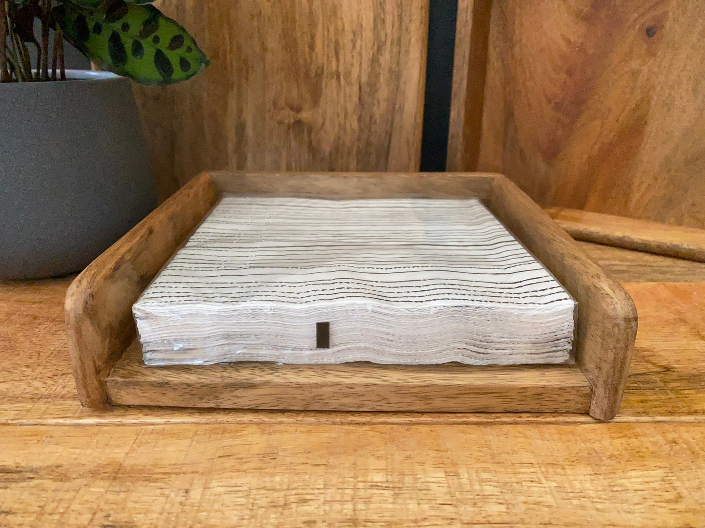 Mango wood napkin holder - standard size. Table view.