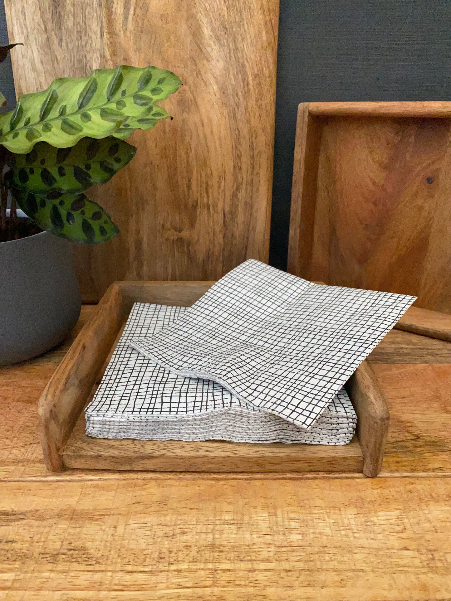 Mango wood napkin holder - standard size. With napkins being selected.