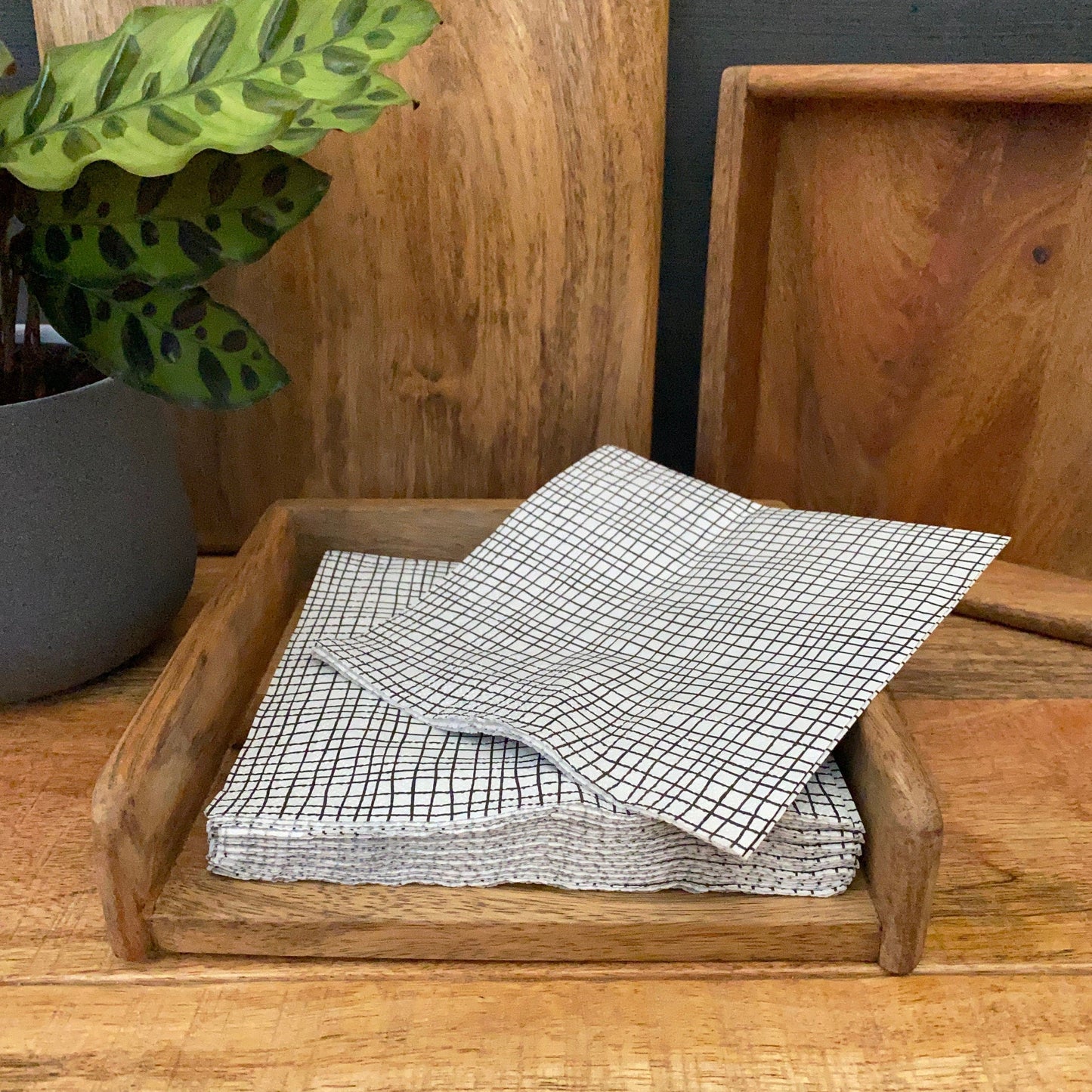 Mango wood napkin holder - standard size. With napkins being selected.